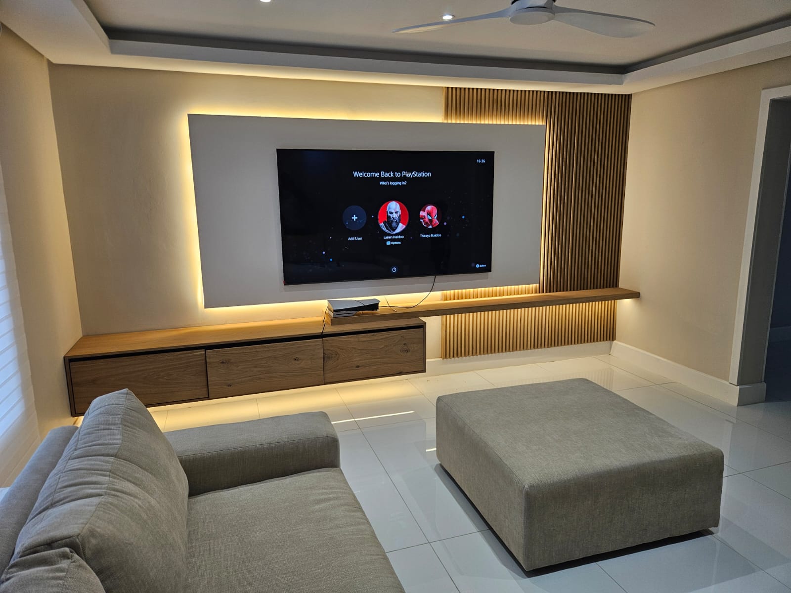Backlit TV feature wall with floating cabinetry